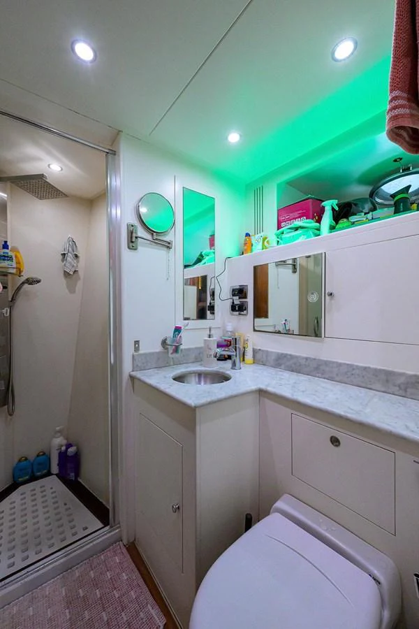 A well-appointed yacht bathroom with modern fixtures and ambient lighting. aboard BENETTI CLASSIC Yacht for Sale
