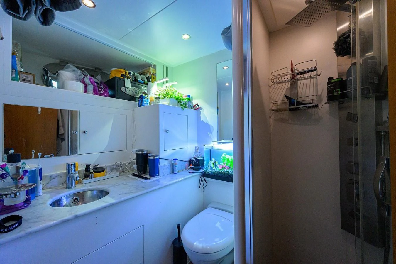 This image showcases a well-equipped yacht bathroom with modern amenities. aboard BENETTI CLASSIC Yacht for Sale