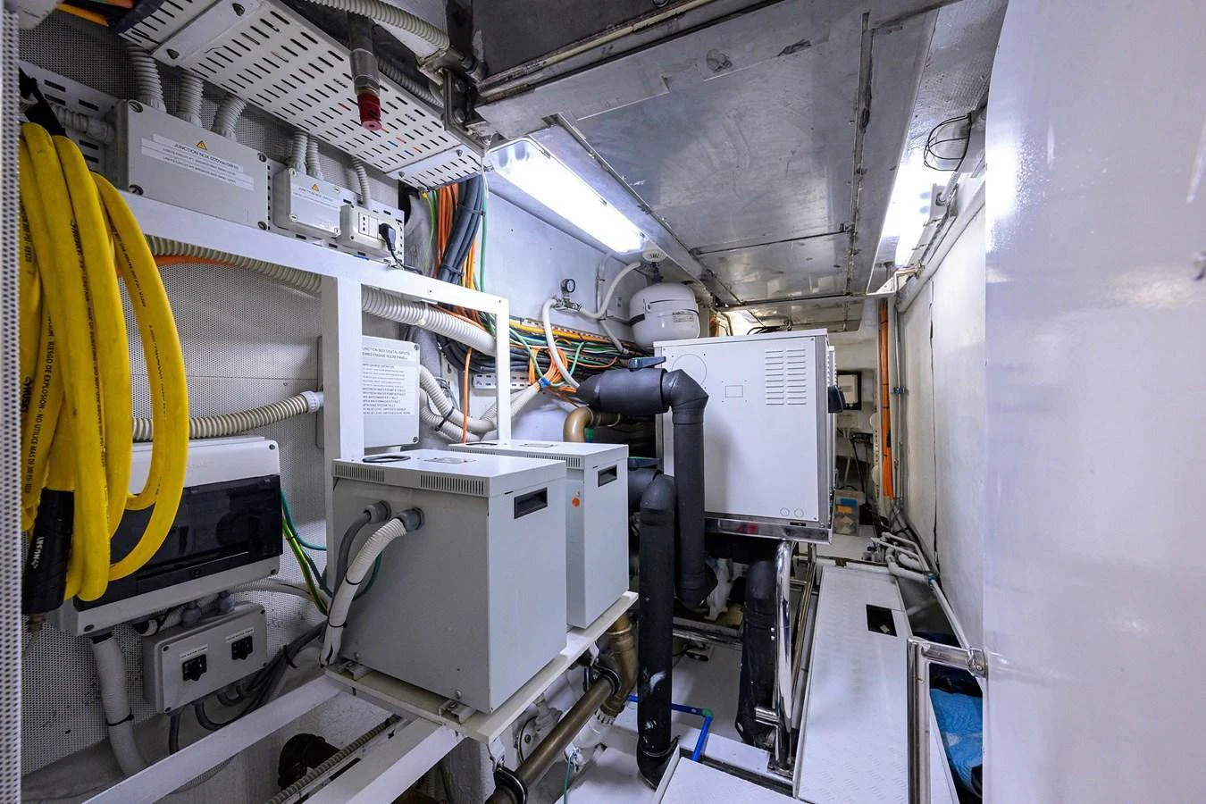 The image showcases the yacht's well-organized engine room with various machinery and equipment. aboard BENETTI CLASSIC Yacht for Sale
