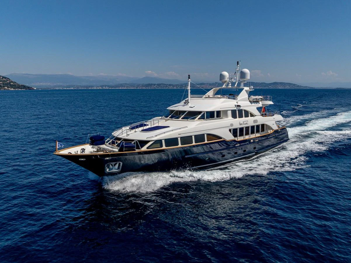A sleek and elegant yacht cruises through the open water on a clear day. aboard SEA BLUEZ Yacht for Sale