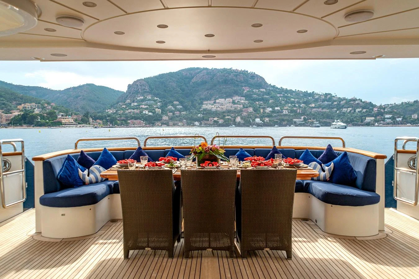 The aft deck offers an inviting dining area with stunning views of the surrounding landscape. aboard SEA BLUEZ Yacht for Sale