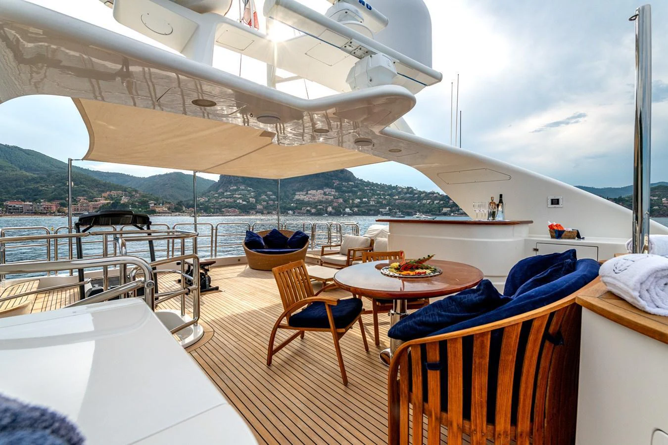 The flybridge offers a luxurious outdoor seating area with a stunning view of the surrounding waters. aboard SEA BLUEZ Yacht for Sale