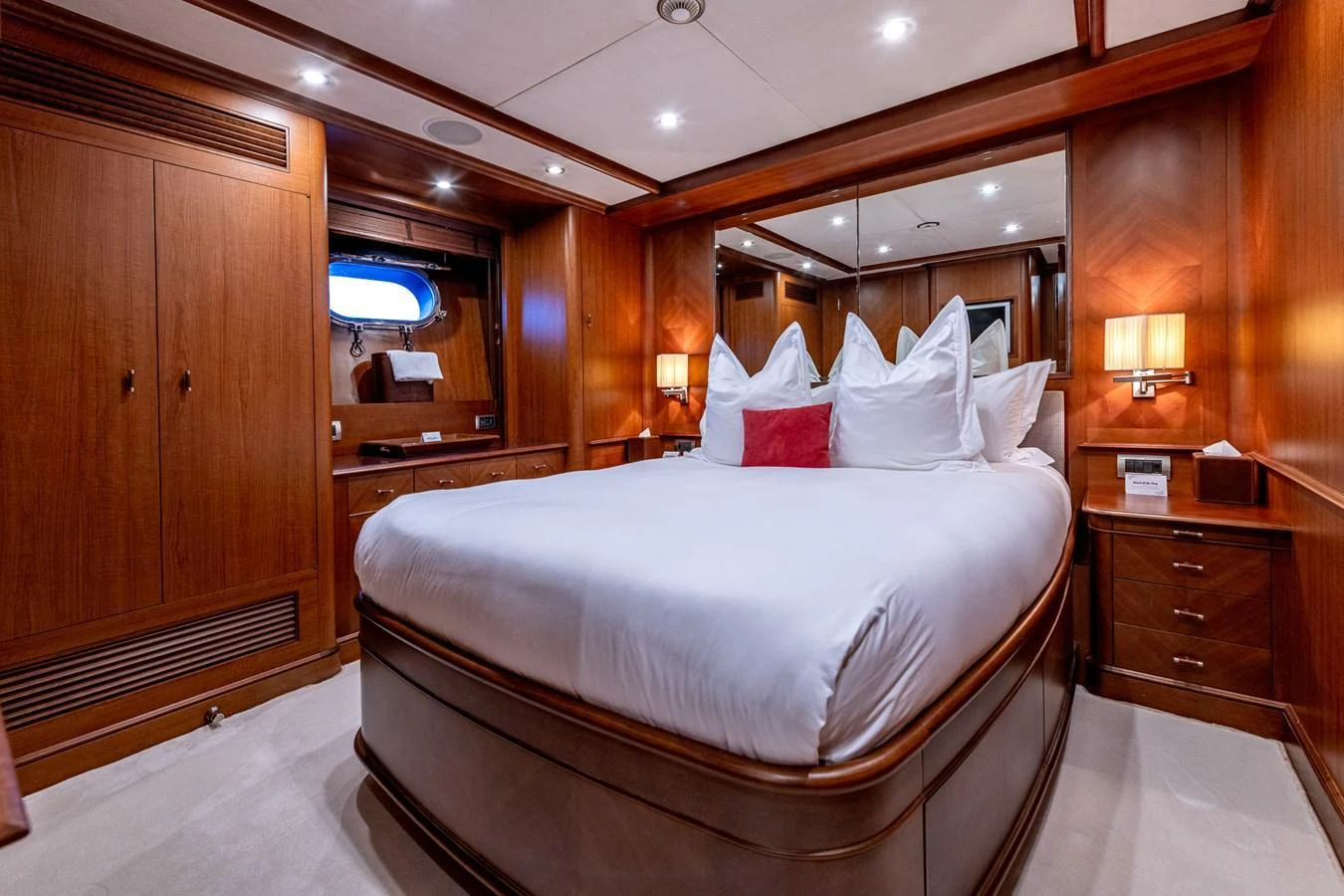 The master stateroom features a luxurious bed with plush pillows and elegant wooden furnishings. aboard SEA BLUEZ Yacht for Sale