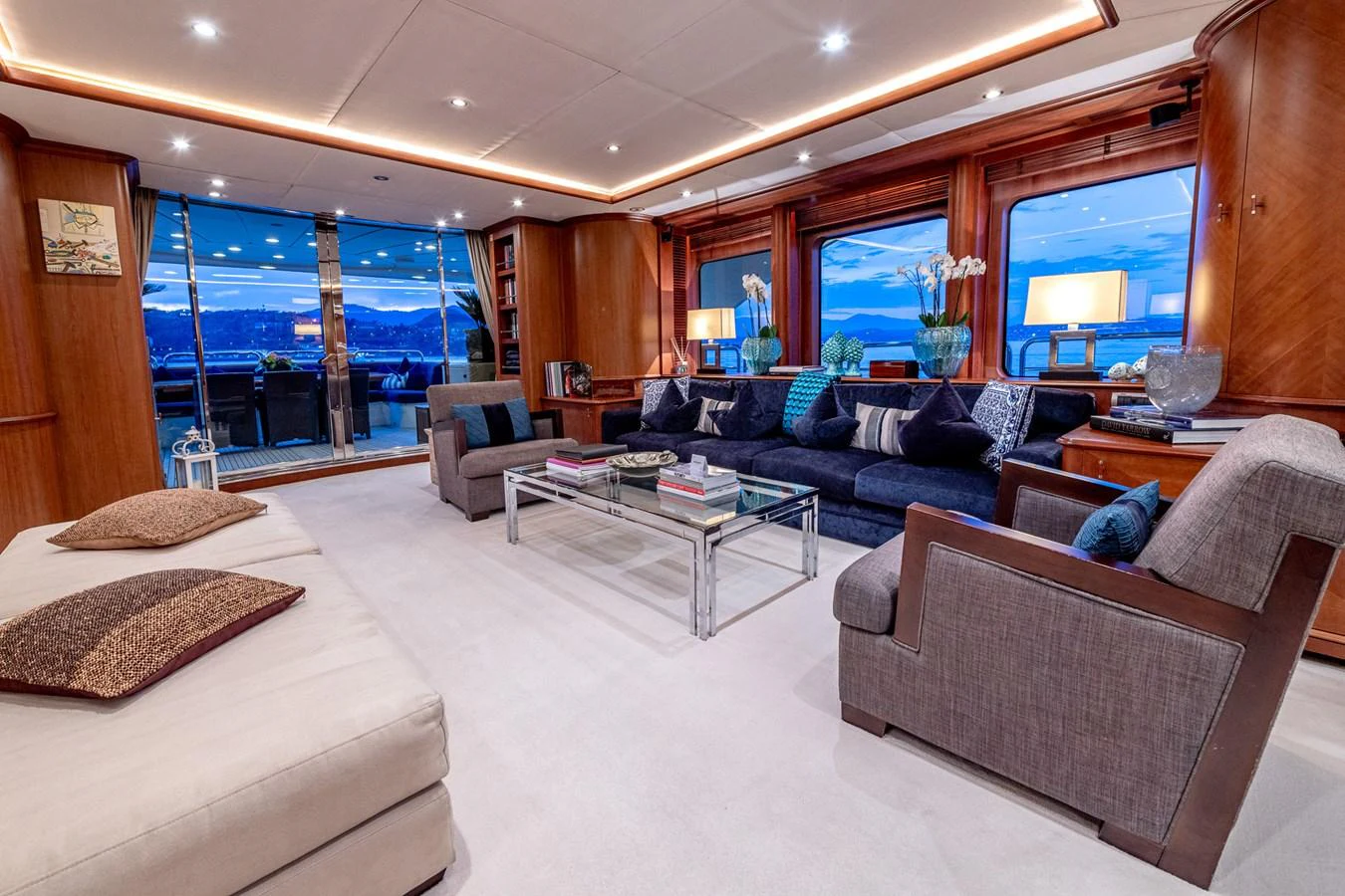 The salon offers a spacious and luxurious seating area with elegant furnishings and panoramic views. aboard SEA BLUEZ Yacht for Sale