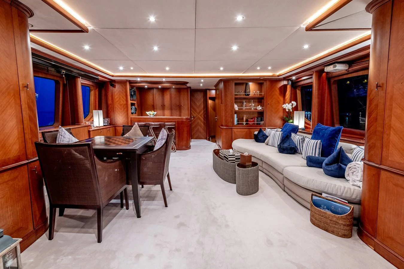 The salon features elegant wood paneling, plush seating, and a dining area, creating a luxurious and inviting atmosphere. aboard SEA BLUEZ Yacht for Sale