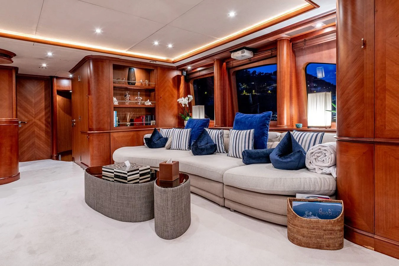 The yacht's salon features luxurious seating with plush cushions and elegant wood paneling. aboard SEA BLUEZ Yacht for Sale