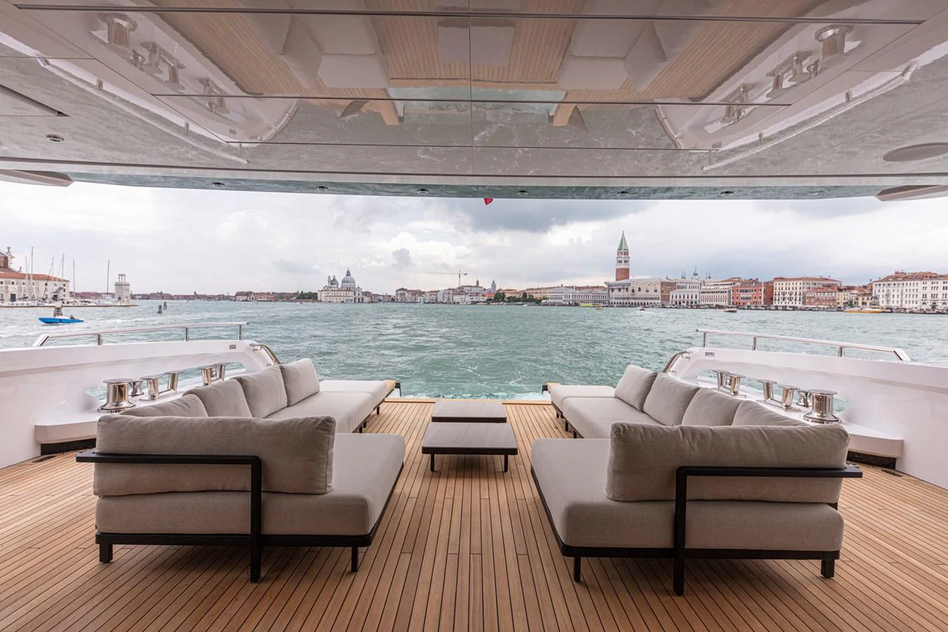 The aft deck offers a luxurious seating area with stunning views of the surrounding waters and cityscape. aboard DUCALE 120 Yacht for Sale