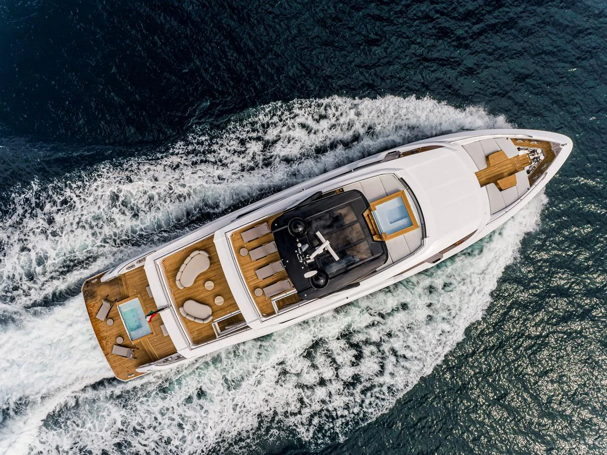 An aerial view of a luxurious yacht cruising through the water, showcasing its sleek design and spacious deck areas. aboard DUCALE 120 Yacht for Sale