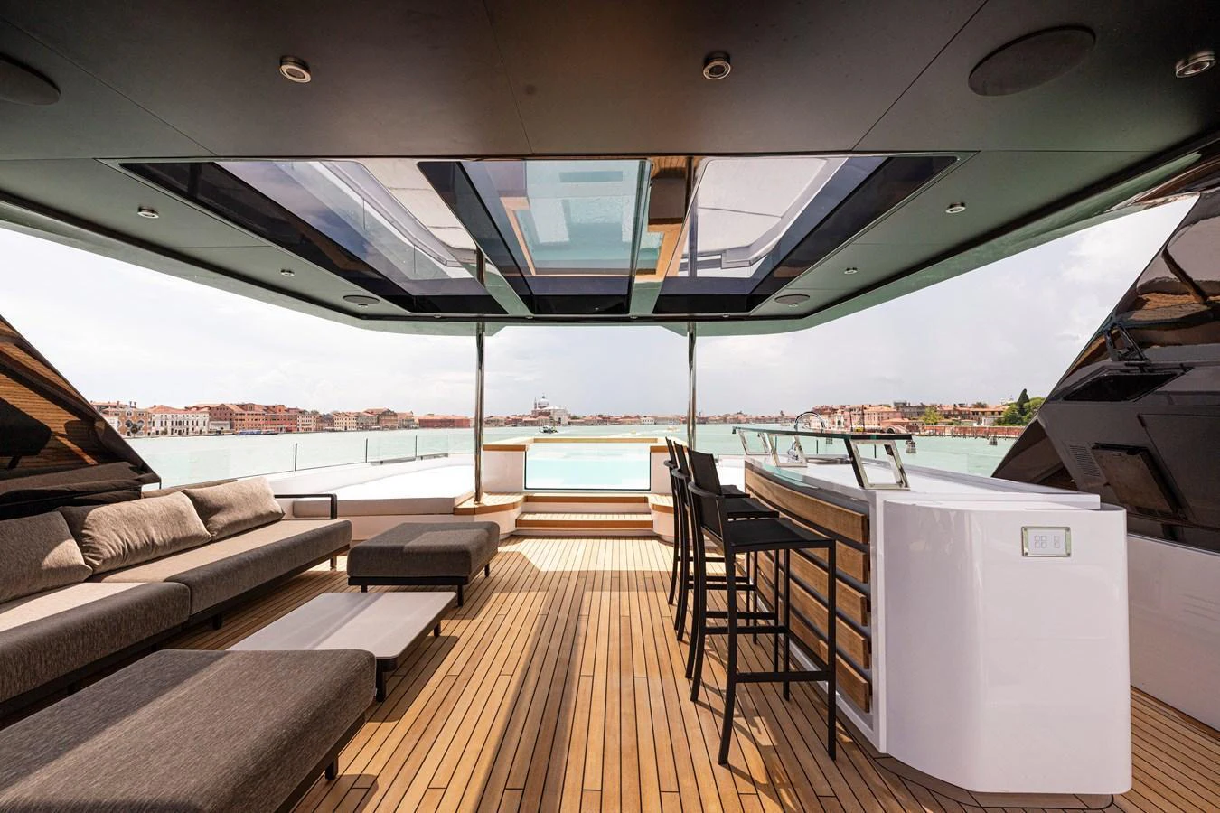 The sundeck offers a luxurious space with ample seating, a bar area, and stunning views. aboard DUCALE 120 Yacht for Sale