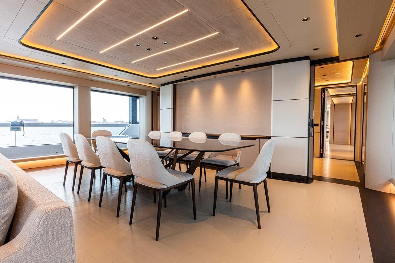 The yacht's dining area features a modern and elegant design with large windows offering stunning views. aboard DUCALE 120 Yacht for Sale