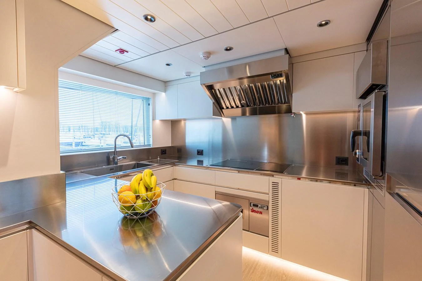 The yacht's galley features modern stainless steel appliances and sleek countertops, creating a stylish and functional space for culinary endeavors. aboard DUCALE 120 Yacht for Sale