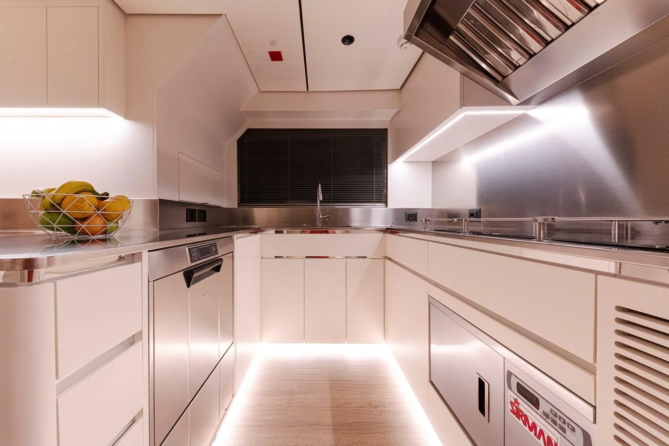 The yacht's galley is equipped with modern appliances and sleek cabinetry, creating a functional and stylish cooking space. aboard DUCALE 120 Yacht for Sale