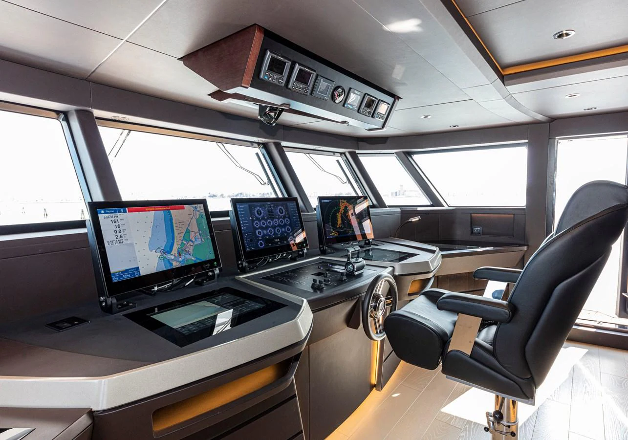 The helm station features advanced navigation equipment and a comfortable captain's chair. aboard DUCALE 120 Yacht for Sale