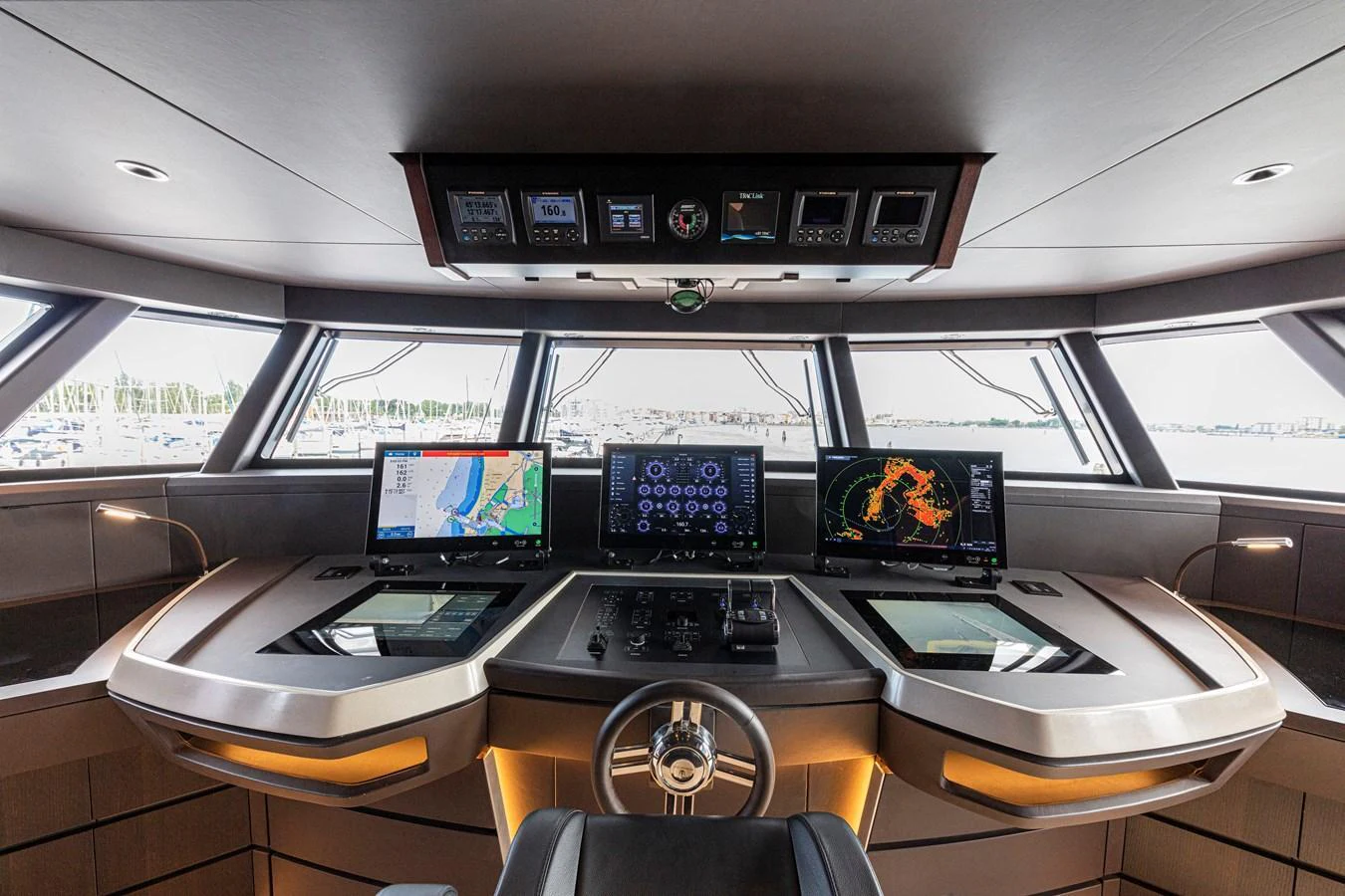 The helm station features advanced navigation systems and a panoramic view. aboard DUCALE 120 Yacht for Sale