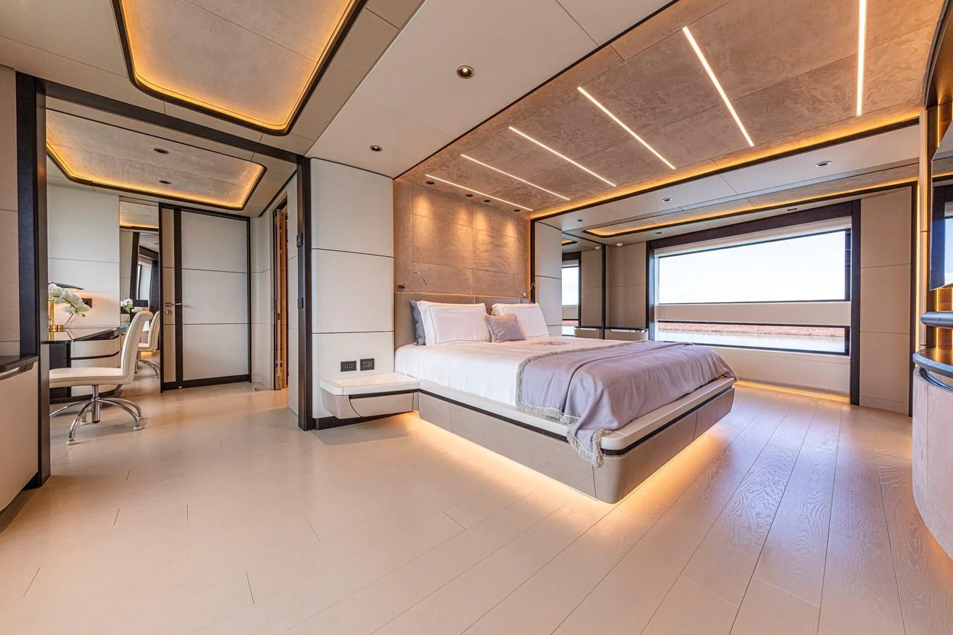 The master stateroom features a spacious layout with modern lighting and large windows offering stunning views. aboard DUCALE 120 Yacht for Sale