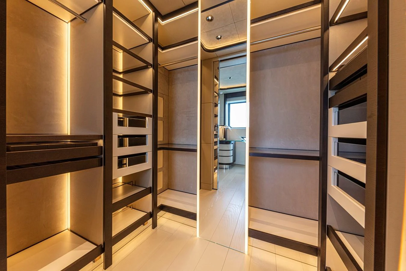 The yacht features a spacious and well-lit walk-in closet with ample shelving and storage space. aboard DUCALE 120 Yacht for Sale