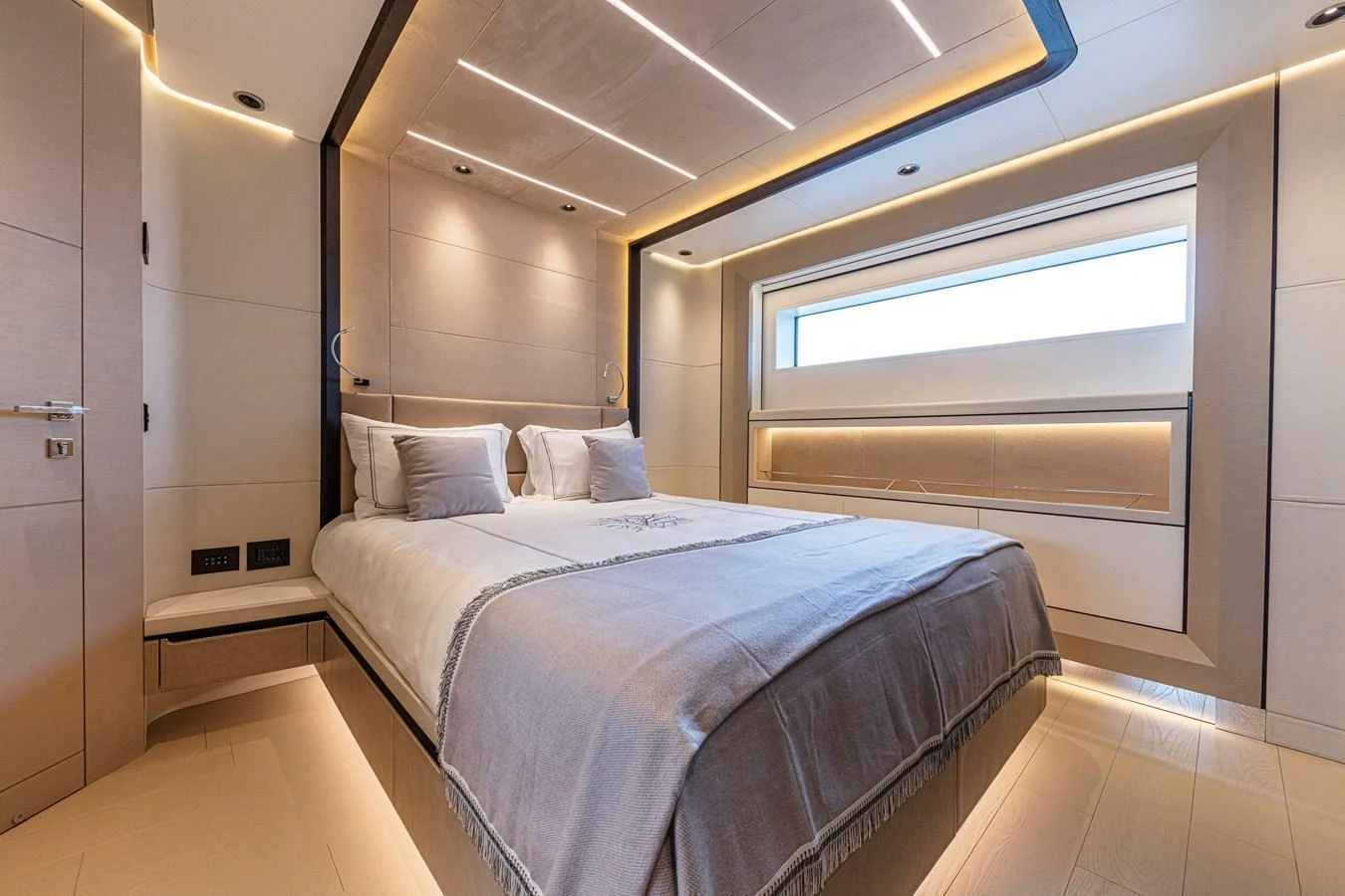 A luxurious stateroom featuring a large bed and modern lighting. aboard DUCALE 120 Yacht for Sale