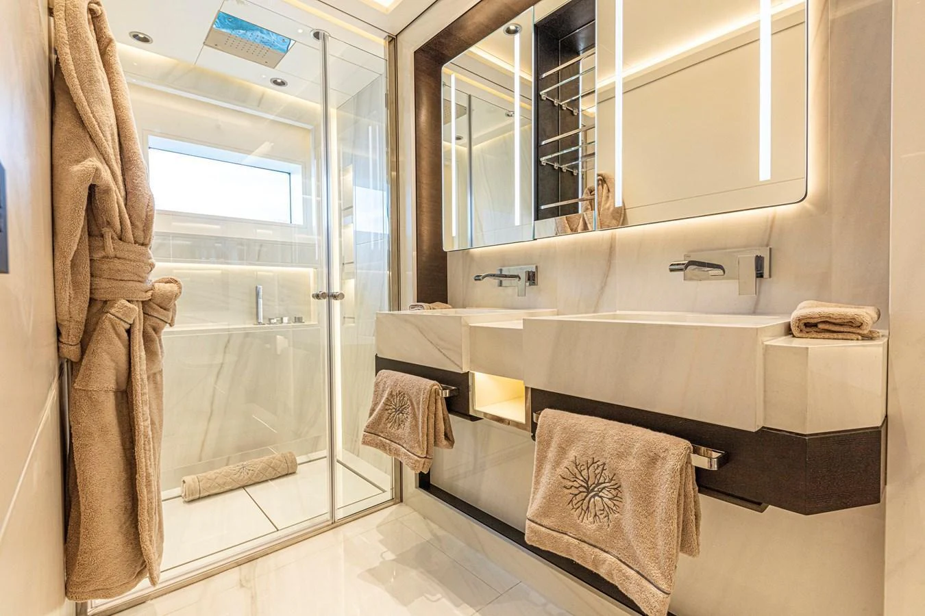 The yacht's bathroom features a luxurious double sink and a spacious glass-enclosed shower. aboard DUCALE 120 Yacht for Sale