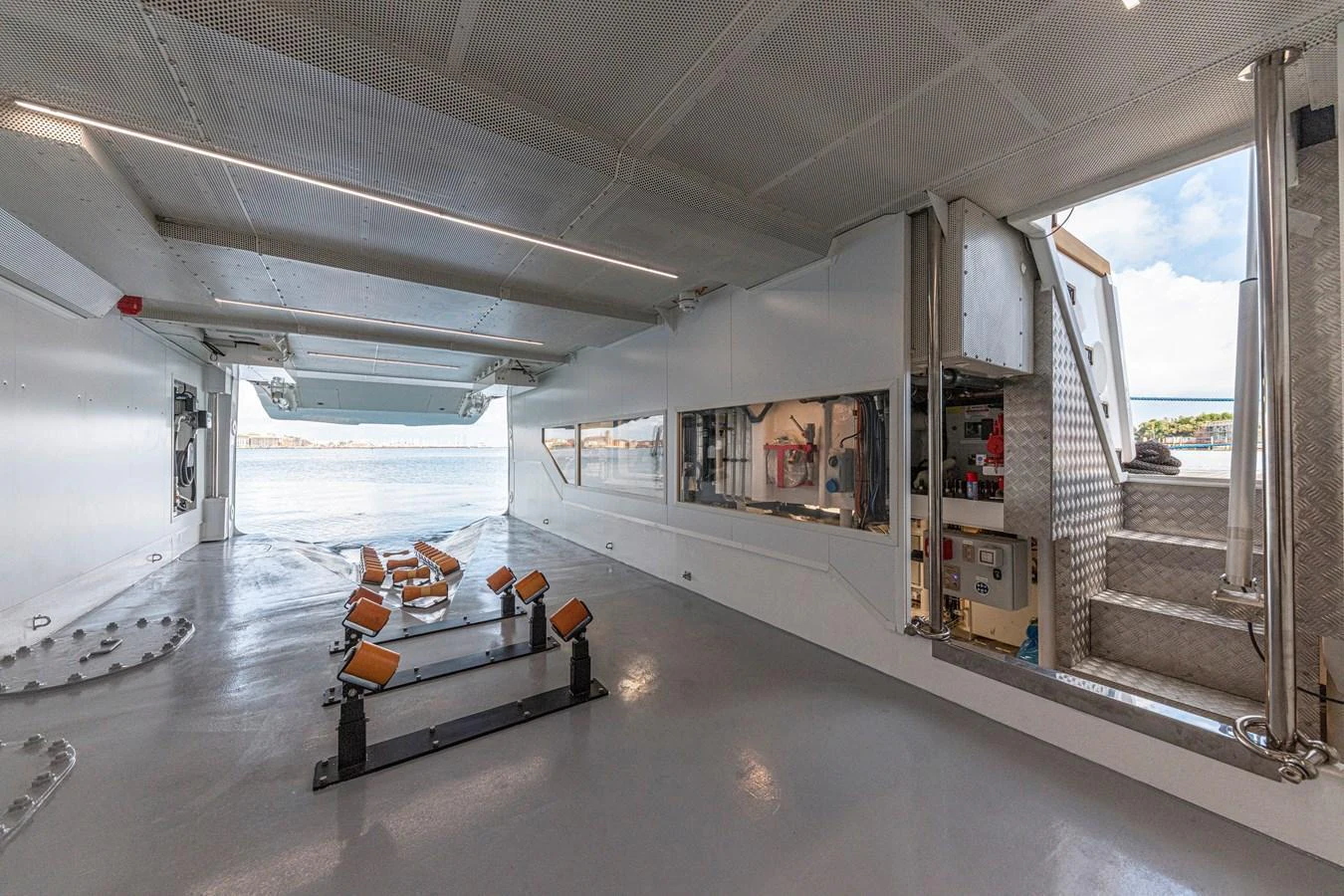 The yacht's garage is spacious and well-equipped, featuring ample storage and access to the water. aboard DUCALE 120 Yacht for Sale