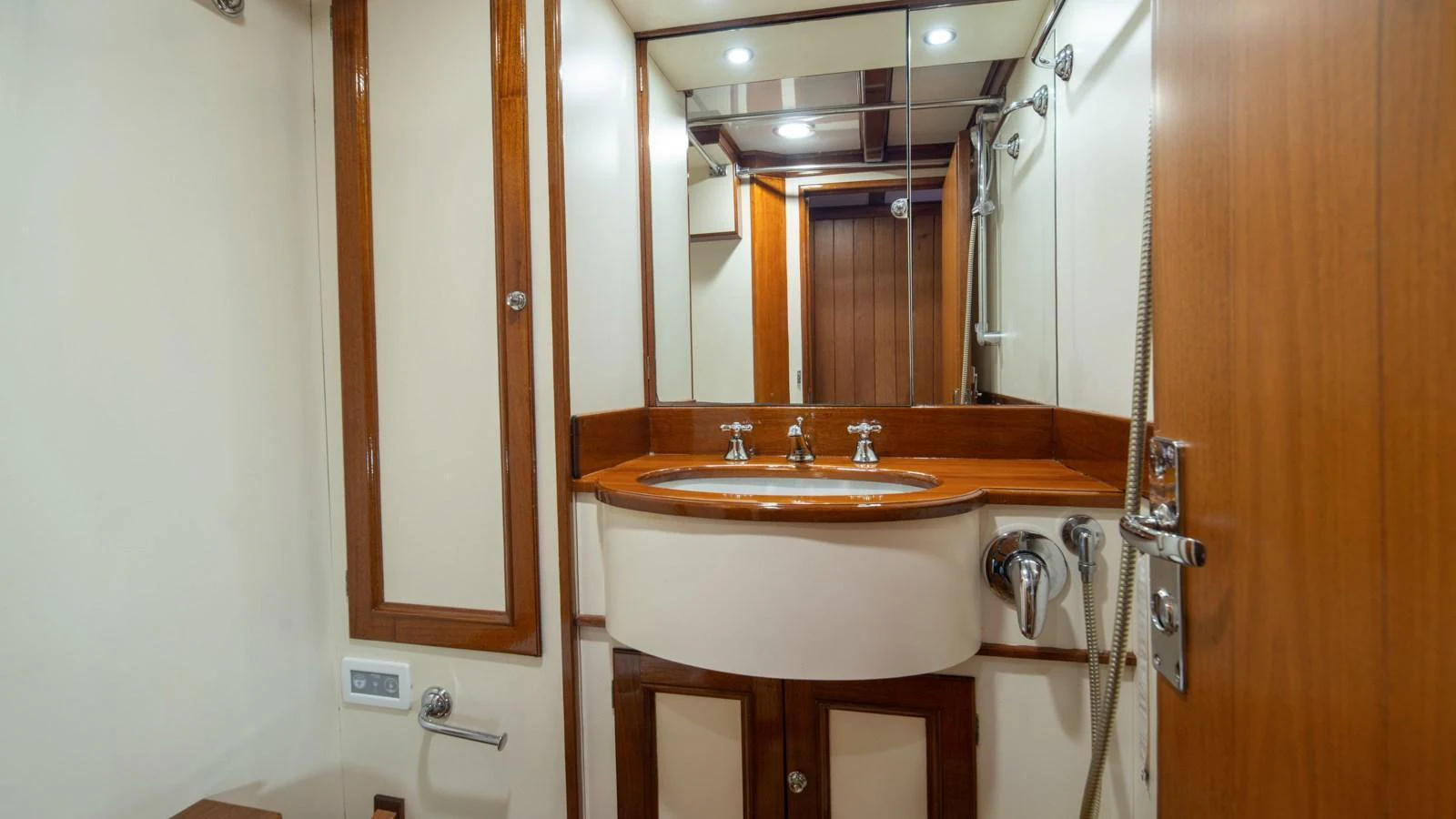 A well-appointed yacht bathroom featuring wooden accents and modern fixtures. aboard CANDIDA Yacht for Sale