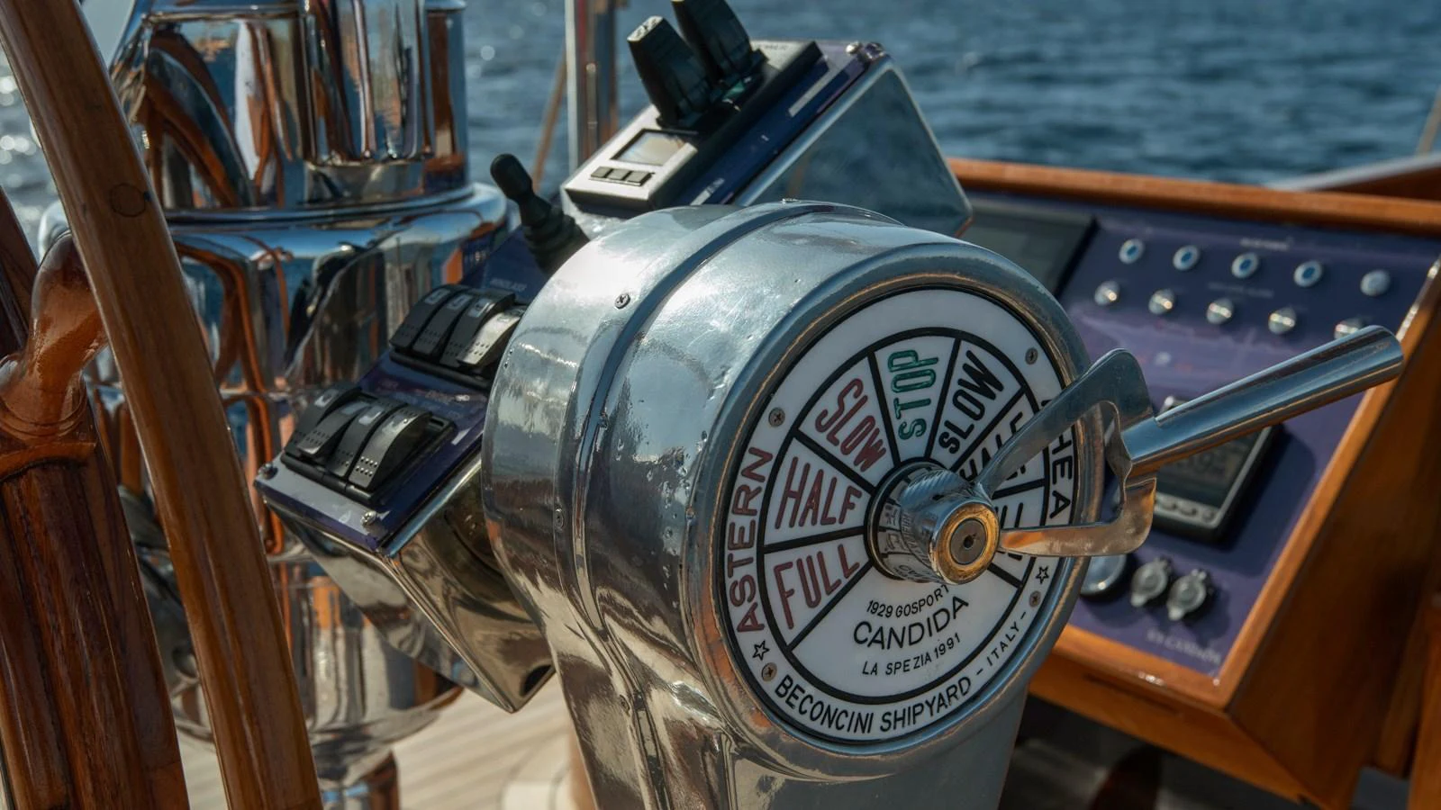 The image showcases the helm controls of the yacht, highlighting the throttle and navigation instruments. aboard CANDIDA Yacht for Sale