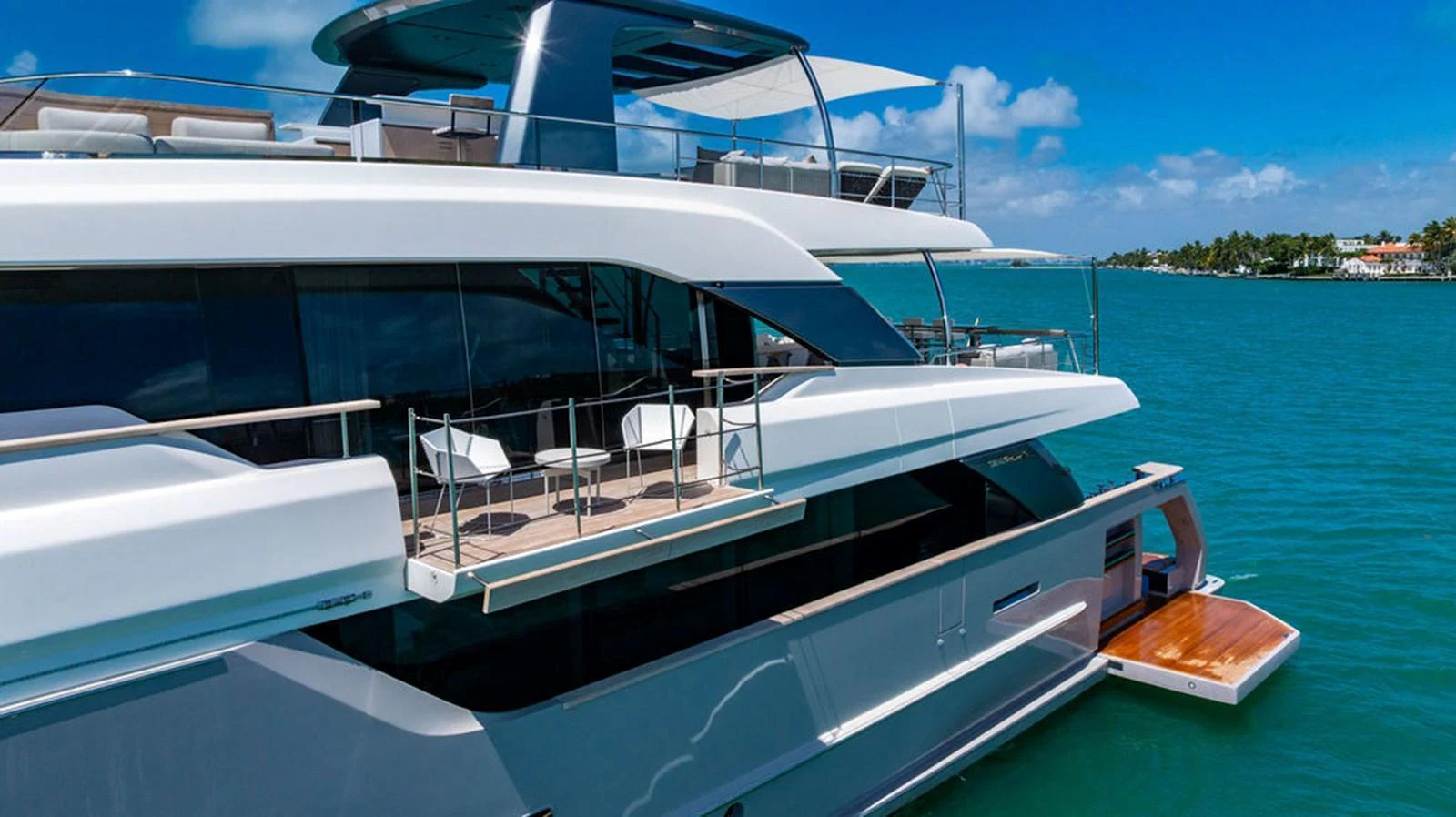 A luxurious yacht with multiple decks and sleek design cruising in clear blue waters. aboard SANLORENZO SD118/129 Yacht for Sale