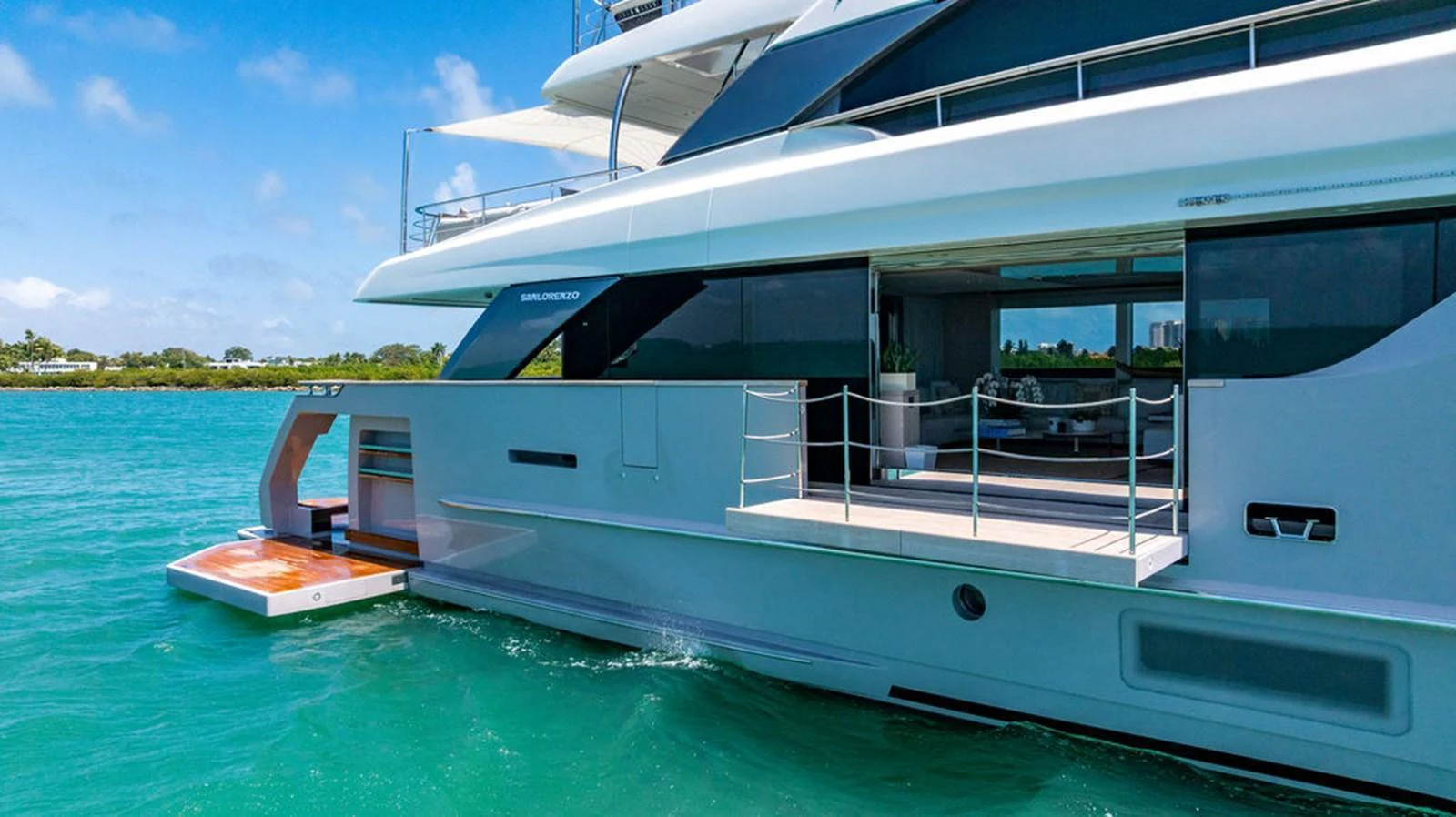 A sleek and modern yacht cruising on clear blue waters with an open deck area. aboard SANLORENZO SD118/129 Yacht for Sale