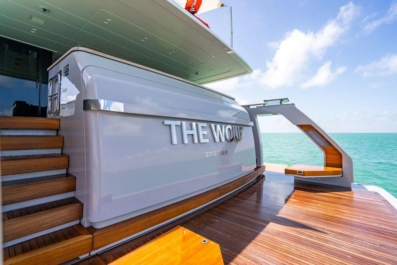 The aft deck features sleek design elements and luxurious wood finishes, perfect for relaxation and enjoying the view. aboard SANLORENZO SD118/129 Yacht for Sale