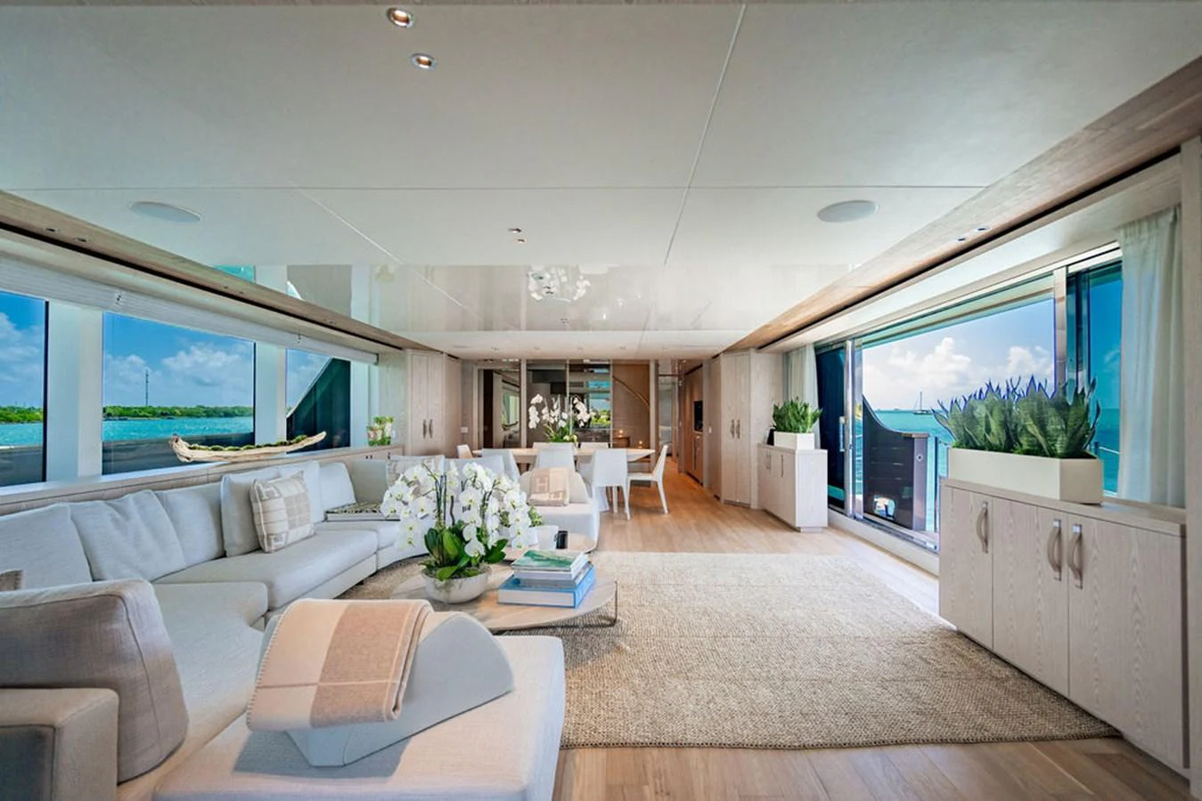The spacious salon offers a luxurious and comfortable setting with ample seating and stunning ocean views. aboard SANLORENZO SD118/129 Yacht for Sale