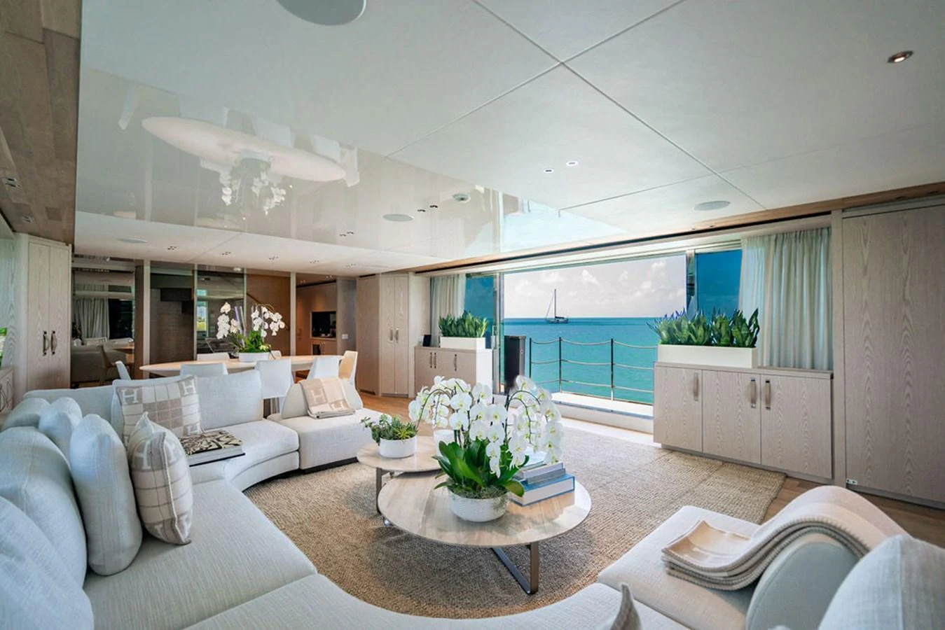 The salon offers a spacious and elegant living area with panoramic ocean views. aboard SANLORENZO SD118/129 Yacht for Sale
