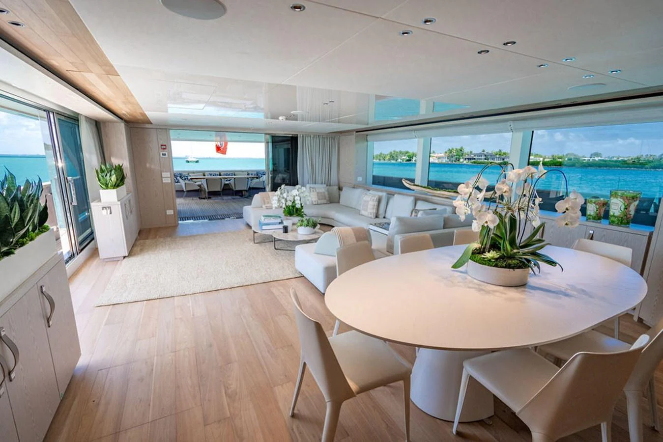 The salon features a spacious and elegant layout with panoramic views of the sea. aboard SANLORENZO SD118/129 Yacht for Sale