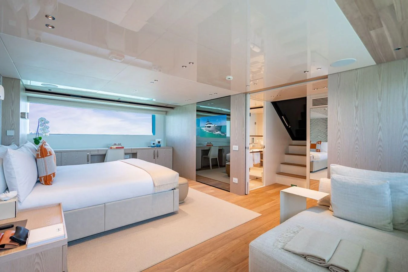 The master stateroom features a spacious bed, modern decor, and ample natural light. aboard SANLORENZO SD118/129 Yacht for Sale