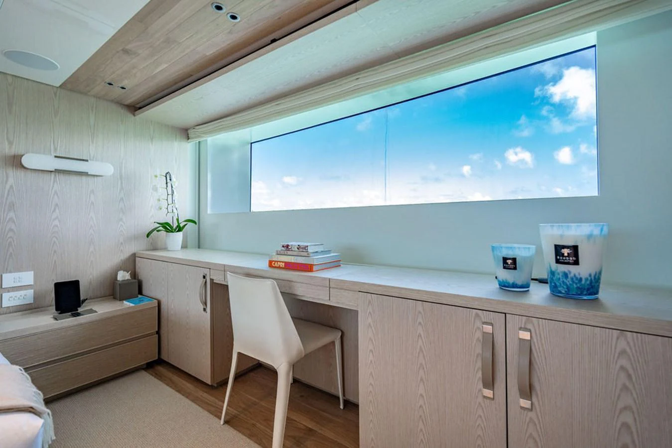 A serene cabin with a large window offering a stunning ocean view. aboard SANLORENZO SD118/129 Yacht for Sale