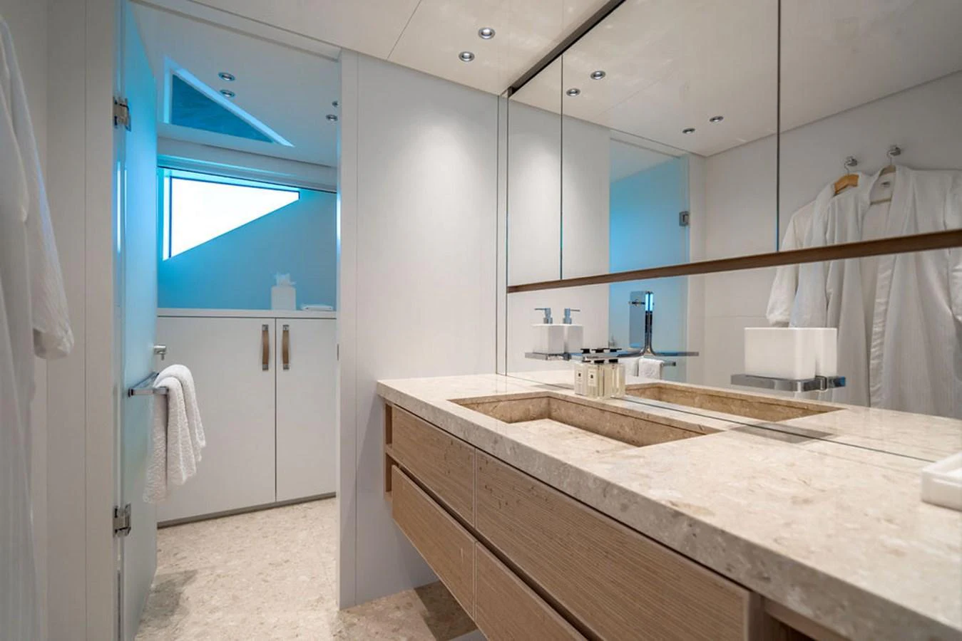 The yacht's bathroom features a sleek, modern design with ample counter space and elegant fixtures. aboard SANLORENZO SD118/129 Yacht for Sale