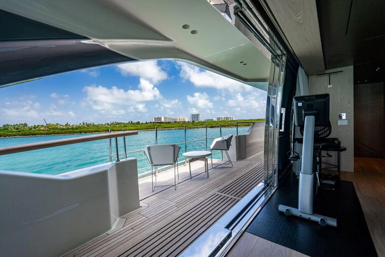 The salon opens up to a spacious deck with stunning views of the water and skyline. aboard SANLORENZO SD118/129 Yacht for Sale