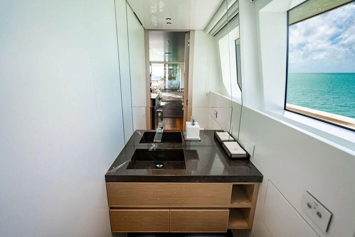 A sleek and modern bathroom with a stunning ocean view. aboard SANLORENZO SD118/129 Yacht for Sale