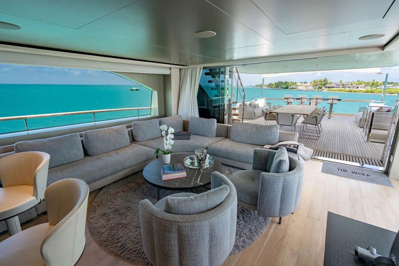 The salon offers a spacious and elegant seating area with panoramic views of the ocean. aboard SANLORENZO SD118/129 Yacht for Sale