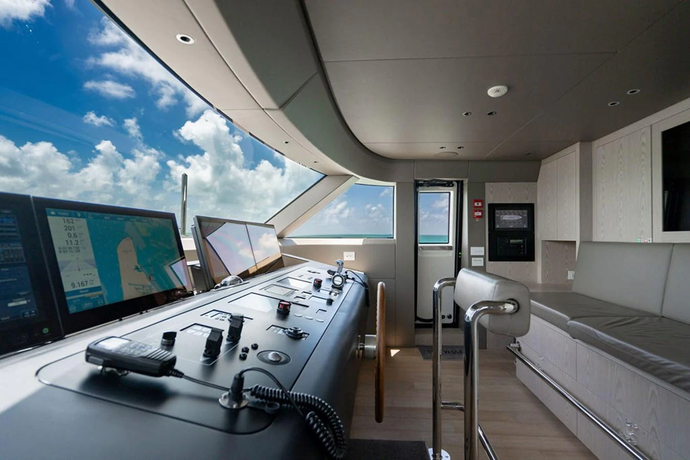 The helm station features advanced navigation equipment and a comfortable seating area with panoramic views. aboard SANLORENZO SD118/129 Yacht for Sale