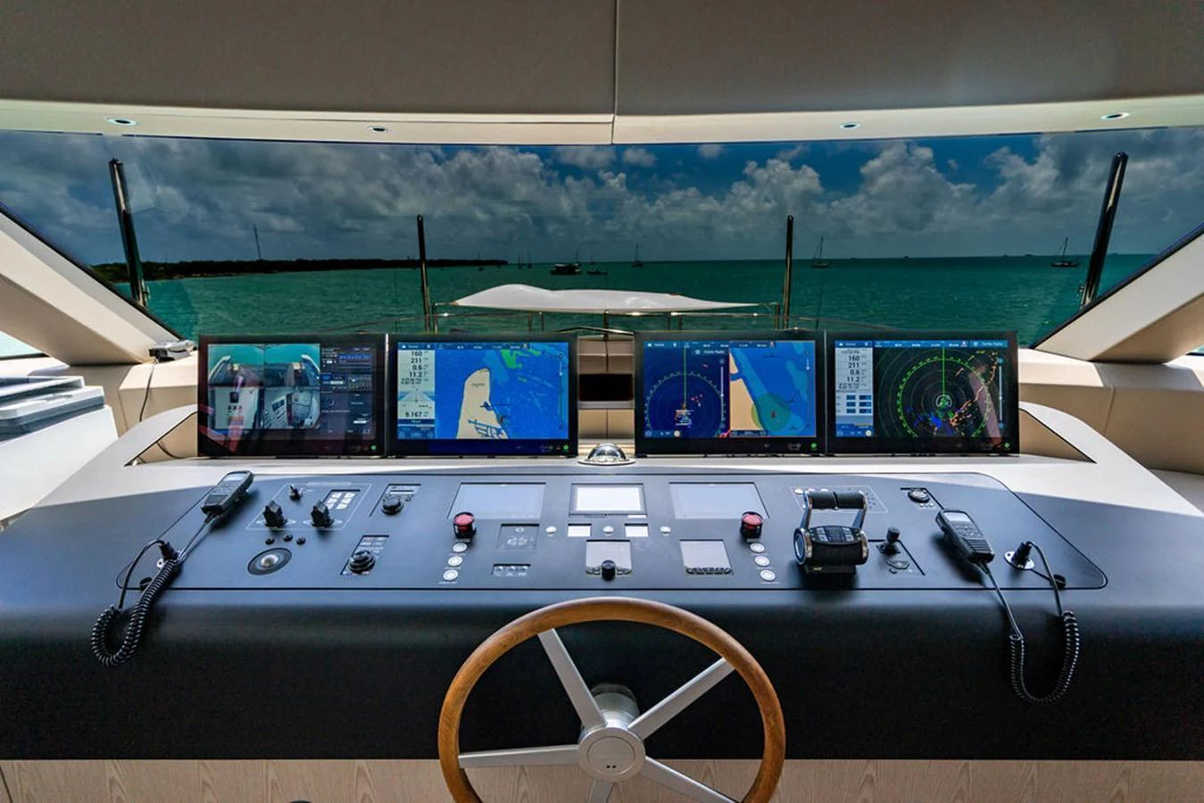 The helm station features advanced navigation equipment and offers a panoramic view of the sea. aboard SANLORENZO SD118/129 Yacht for Sale