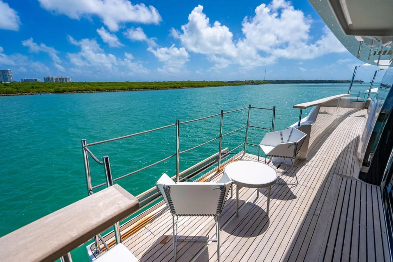 The yacht's deck offers a serene space with comfortable seating and stunning water views. aboard SANLORENZO SD118/129 Yacht for Sale