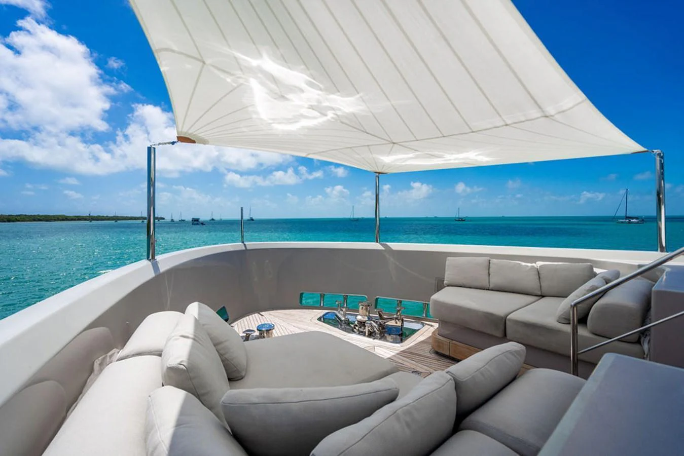 The sundeck offers a luxurious lounging area with comfortable seating and a stunning ocean view. aboard SANLORENZO SD118/129 Yacht for Sale