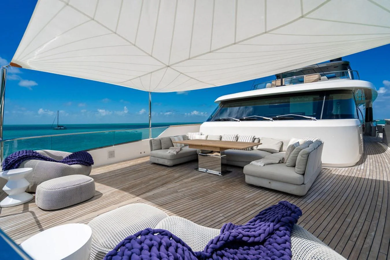 The sundeck offers a spacious and luxurious lounging area with comfortable seating and a stunning ocean view. aboard SANLORENZO SD118/129 Yacht for Sale