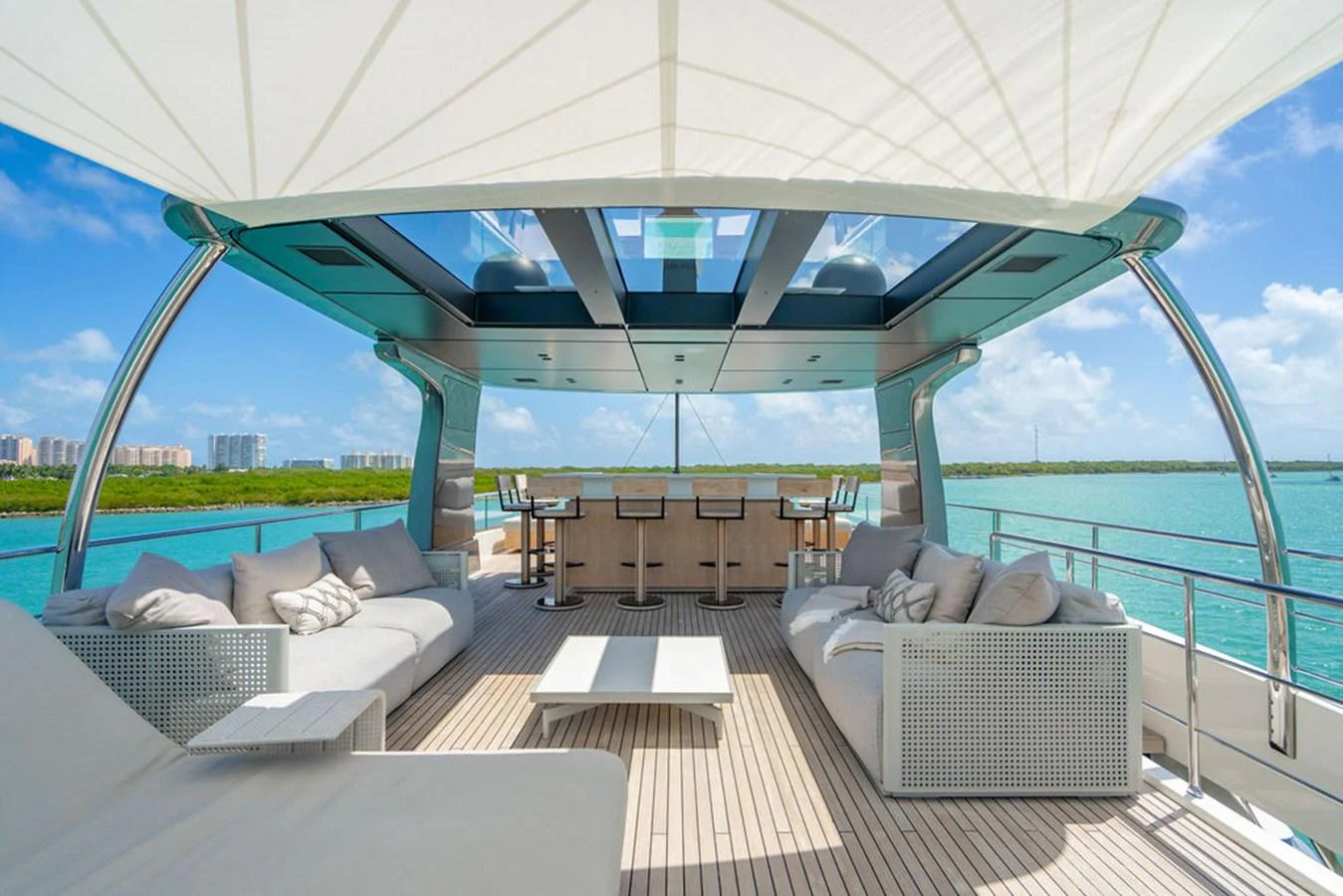 The flybridge offers a spacious and luxurious outdoor lounging area with ample seating and a bar, perfect for relaxation and entertainment. aboard SANLORENZO SD118/129 Yacht for Sale