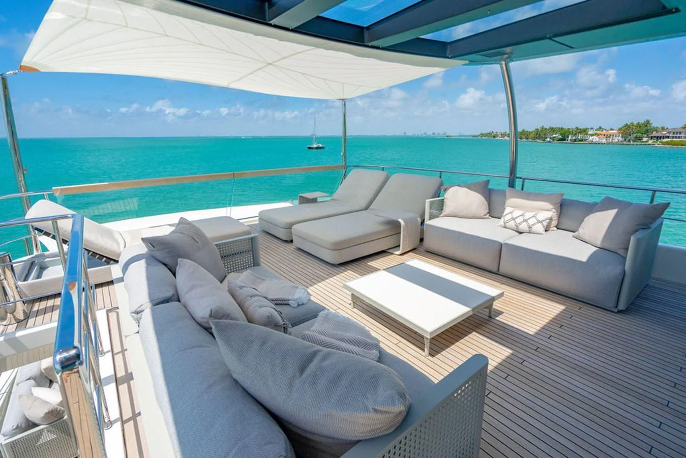 The sundeck offers a luxurious lounging area with plush seating and stunning ocean views. aboard SANLORENZO SD118/129 Yacht for Sale