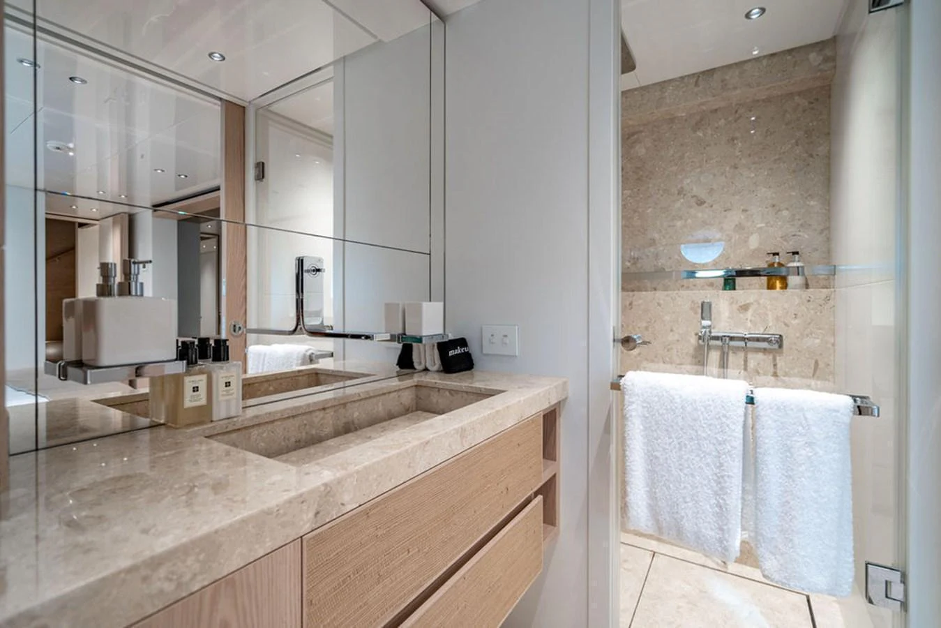 The yacht's bathroom features a sleek design with modern fixtures and luxurious finishes. aboard SANLORENZO SD118/129 Yacht for Sale
