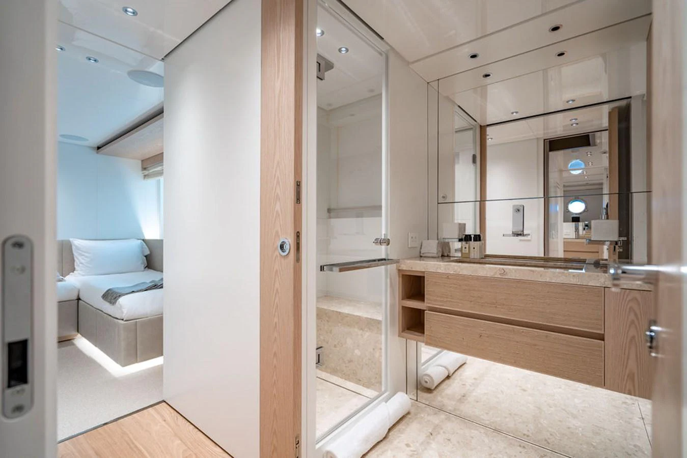 The yacht's bathroom features sleek, modern design with light wood accents and ample lighting. aboard SANLORENZO SD118/129 Yacht for Sale