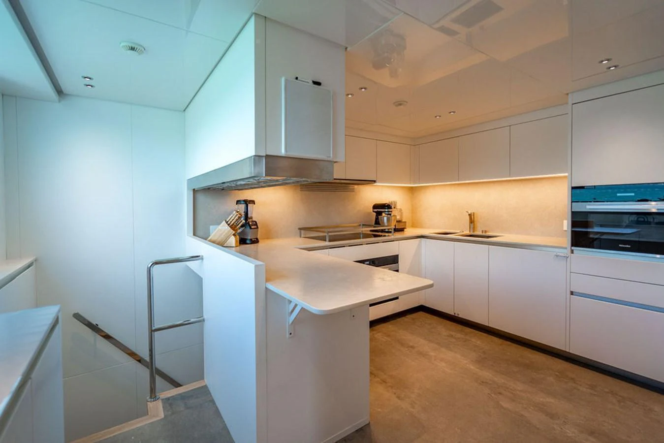 The yacht's galley features modern appliances and a sleek, minimalist design. aboard SANLORENZO SD118/129 Yacht for Sale
