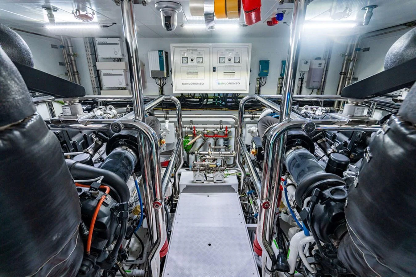 The image showcases the meticulously organized engine room of the yacht, highlighting its advanced machinery and systems. aboard SANLORENZO SD118/129 Yacht for Sale