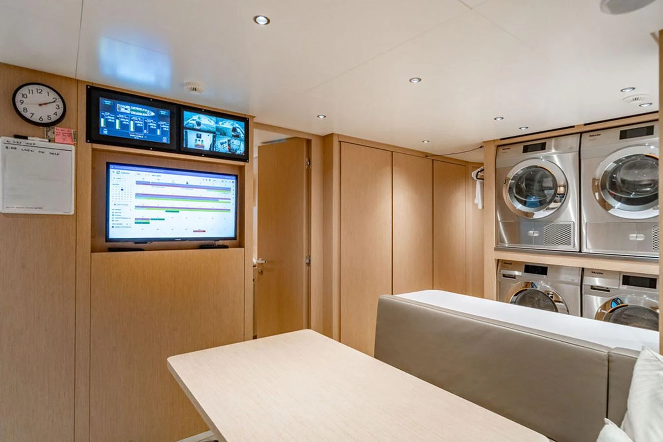 The yacht's laundry room is equipped with modern appliances and a comfortable seating area. aboard SANLORENZO SD118/129 Yacht for Sale