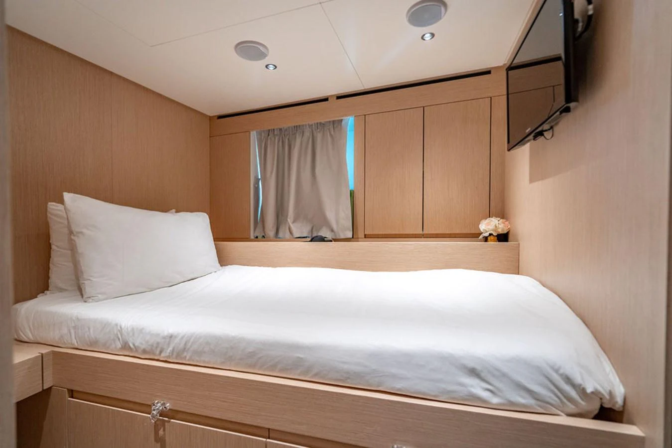 This cozy guest stateroom features a comfortable bed and modern amenities. aboard SANLORENZO SD118/129 Yacht for Sale
